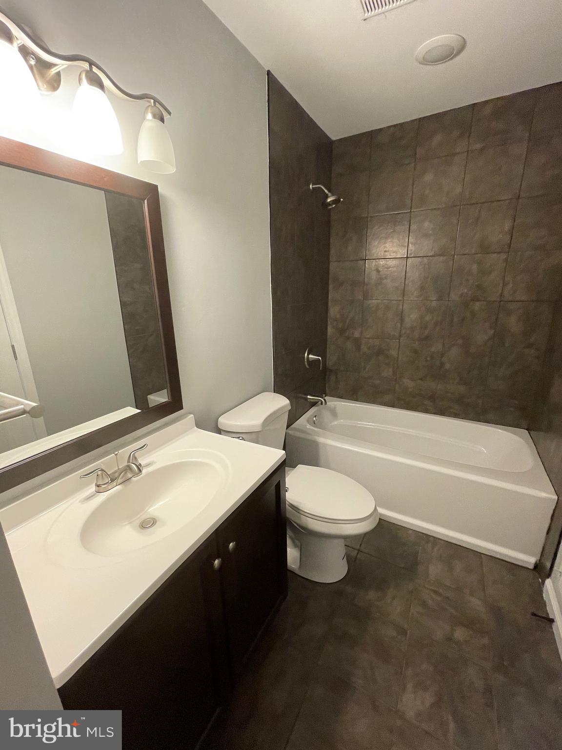 124 Andrew Place Sterling, VA 20164 - Photo 45 of 70 a bathroom with a sink a toilet and shower