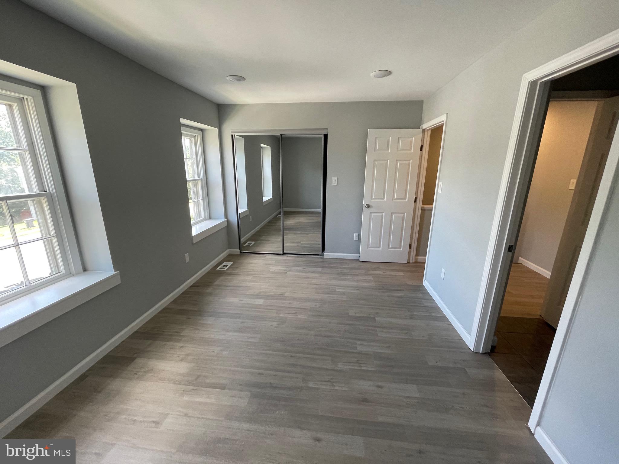 124 Andrew Place Sterling, VA 20164 - Photo 63 of 70 a view of a room with wooden floor and windows