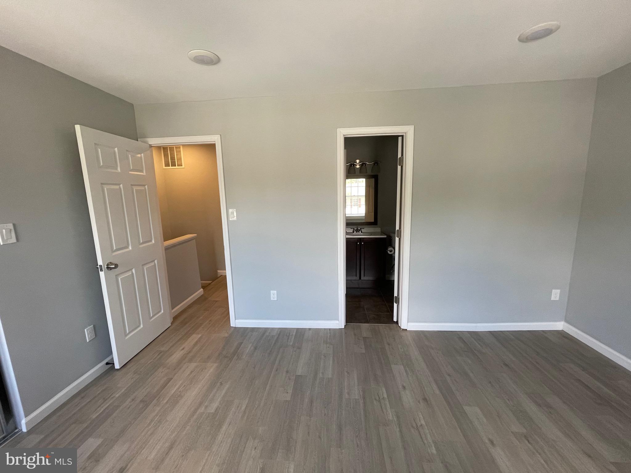 124 Andrew Place Sterling, VA 20164 - Photo 66 of 70 an empty room with wooden floor and entrance