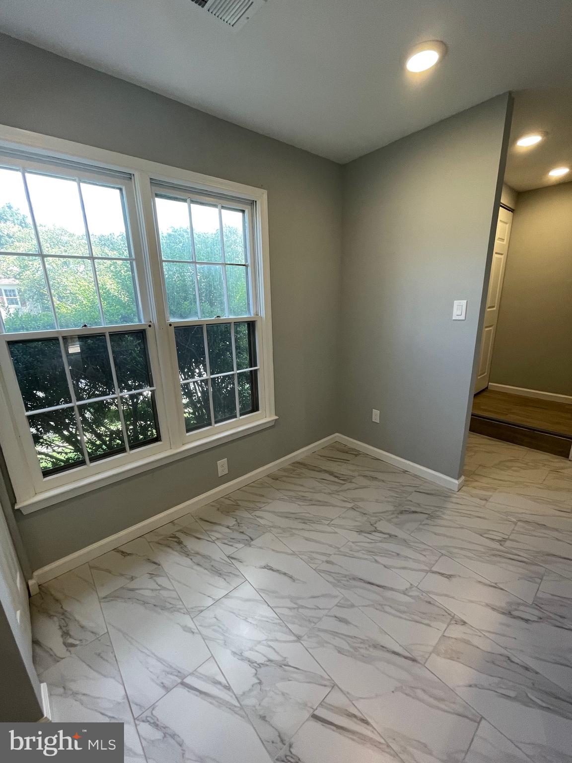 124 Andrew Place Sterling, VA 20164 - Photo 9 of 70 a view of empty room with wooden floor and fan