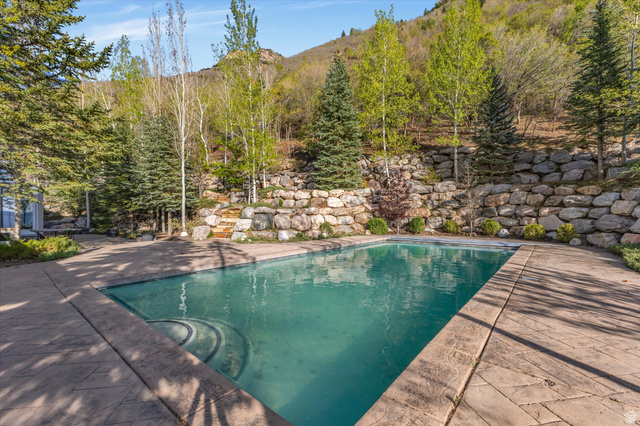 3222 Eagle View Circle Sandy, UT 84092 - Photo 44 of 60 Swimming pool featuring a patio and a mountain view