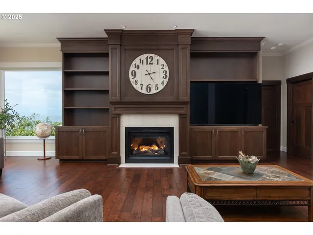 a living room with furniture fireplace and flat screen tv