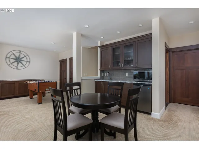 a bedroom with furniture and a flat screen tv