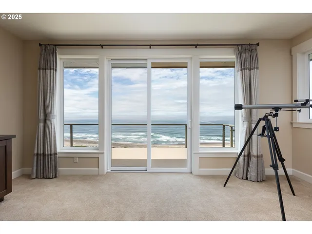 a bedroom with a large bed and a large window