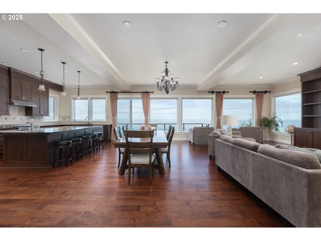 a open kitchen with granite countertop a refrigerator a sink and a window