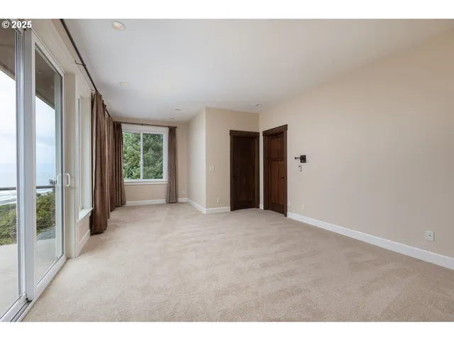 a view of a roof deck with furniture