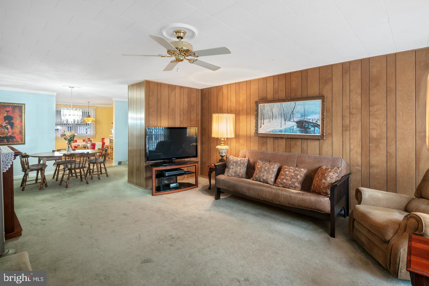 10803 Pedrick Road Philadelphia, PA 19154 - Photo 3 of 25 a living room with furniture and a flat screen tv