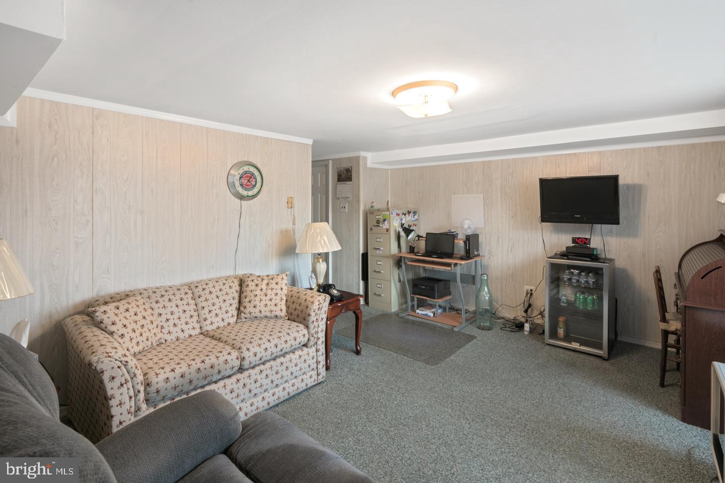 10803 Pedrick Road Philadelphia, PA 19154 - Photo 21 of 25 a living room with furniture and a flat screen tv
