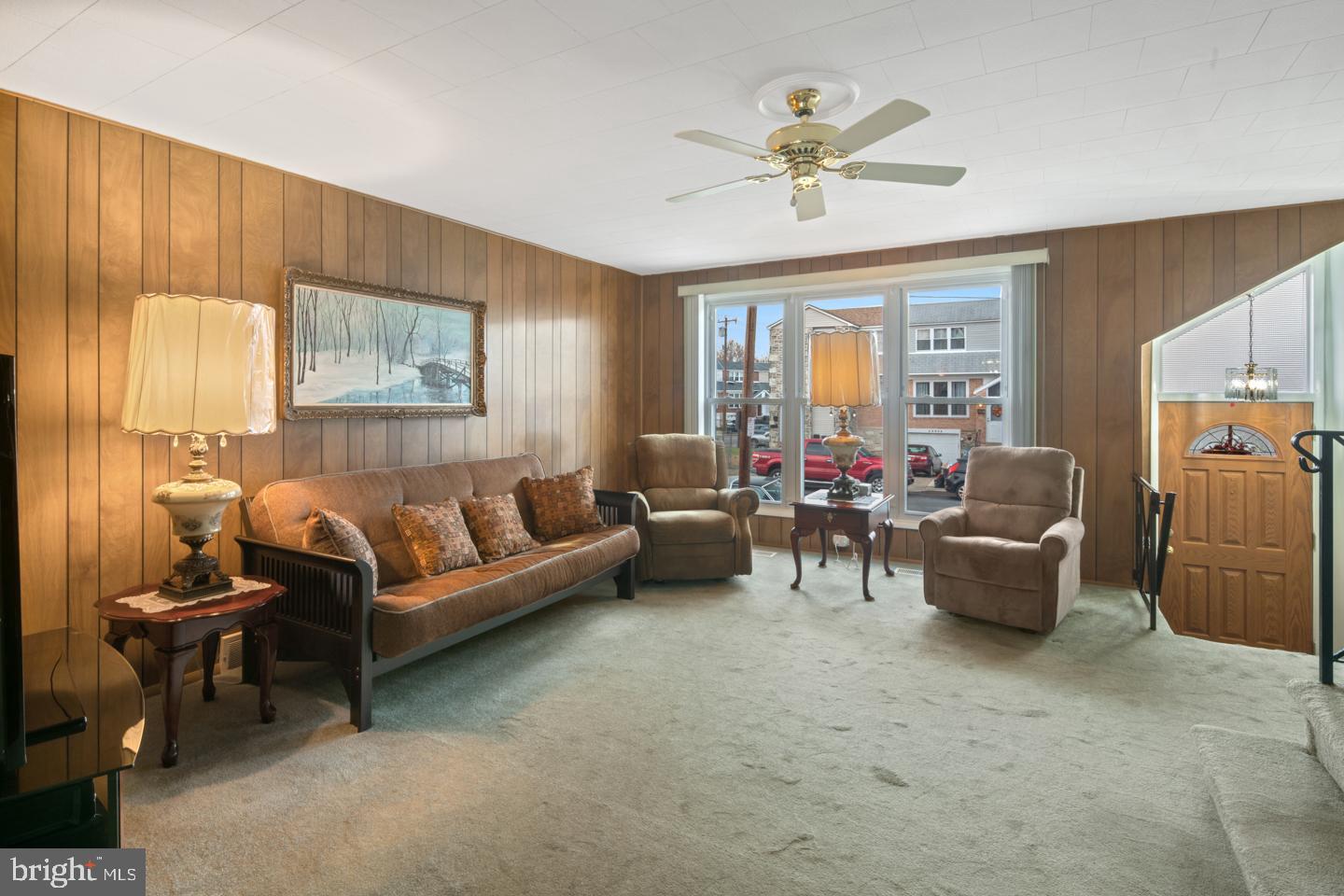 10803 Pedrick Road Philadelphia, PA 19154 - Photo 4 of 25 a living room with furniture and a chandelier