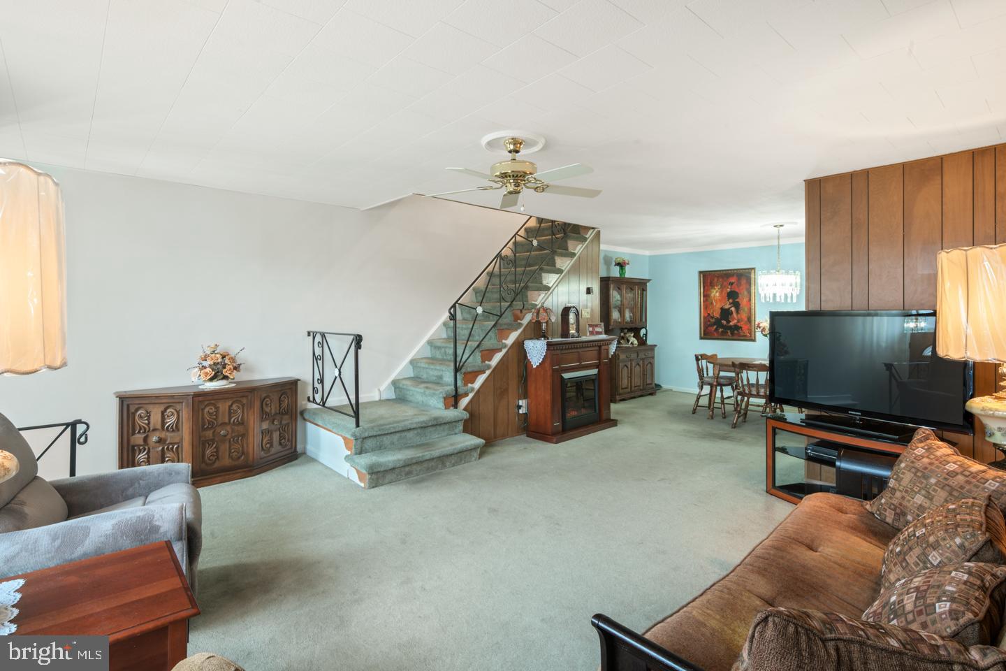10803 Pedrick Road Philadelphia, PA 19154 - Photo 5 of 25 a living room with furniture and a flat screen tv