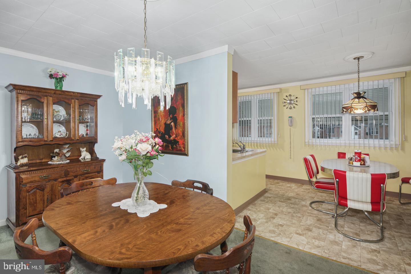 10803 Pedrick Road Philadelphia, PA 19154 - Photo 6 of 25 a dining room with furniture a chandelier and wooden floor