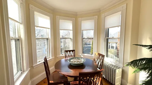 a view of a dining room with furniture window and outside view