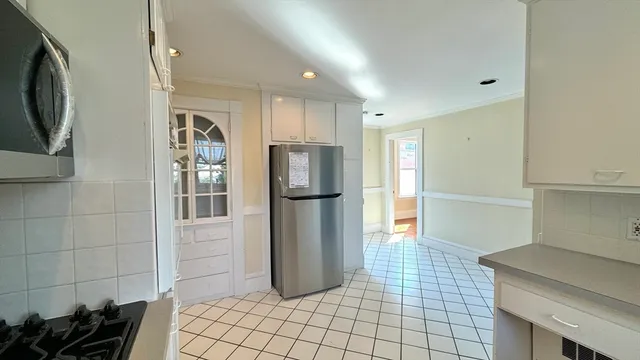 a kitchen with stainless steel appliances cabinets and a counter top space