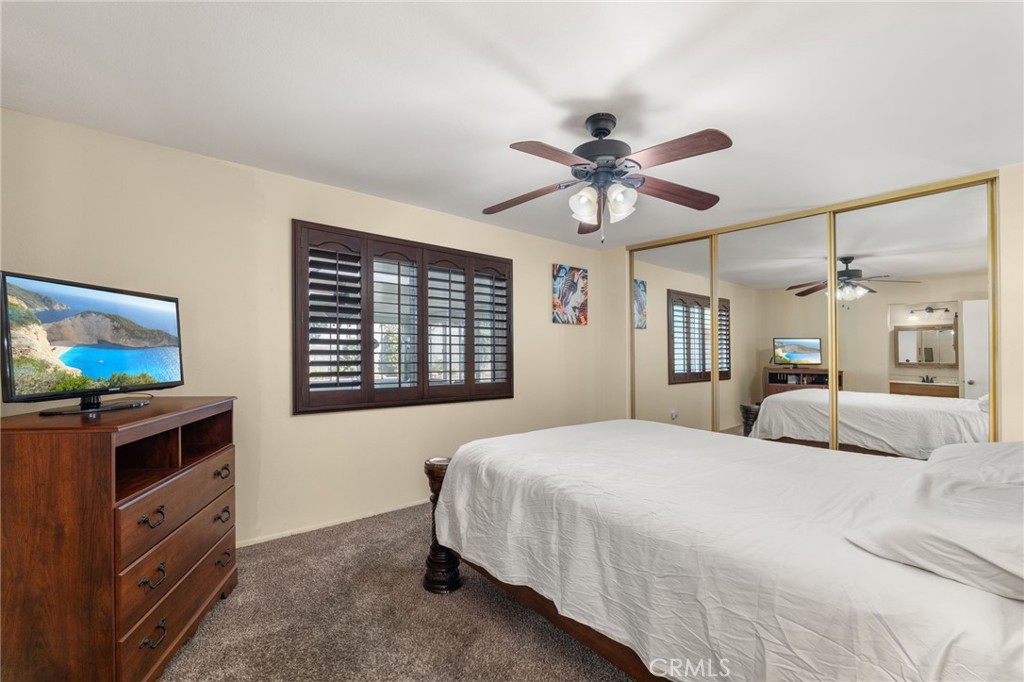 7221 Ramona Avenue Rancho Cucamonga, CA 91701 - Photo 13 of 30 a bedroom with a bed and a flat screen tv
