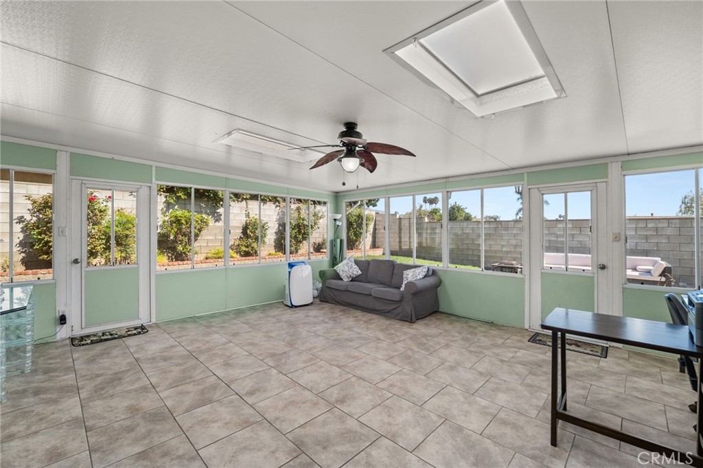 7221 Ramona Avenue Rancho Cucamonga, CA 91701 - Photo 21 of 30 a living room with furniture and a large window