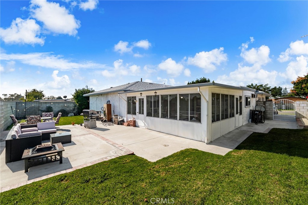 7221 Ramona Avenue Rancho Cucamonga, CA 91701 - Photo 23 of 30 a view of a house with backyard sitting area and roof