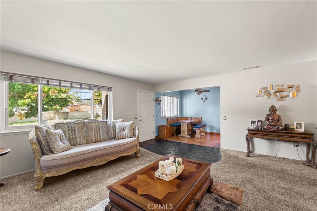 7221 Ramona Avenue Rancho Cucamonga, CA 91701 - Photo 5 of 30 a living room with furniture and a large window