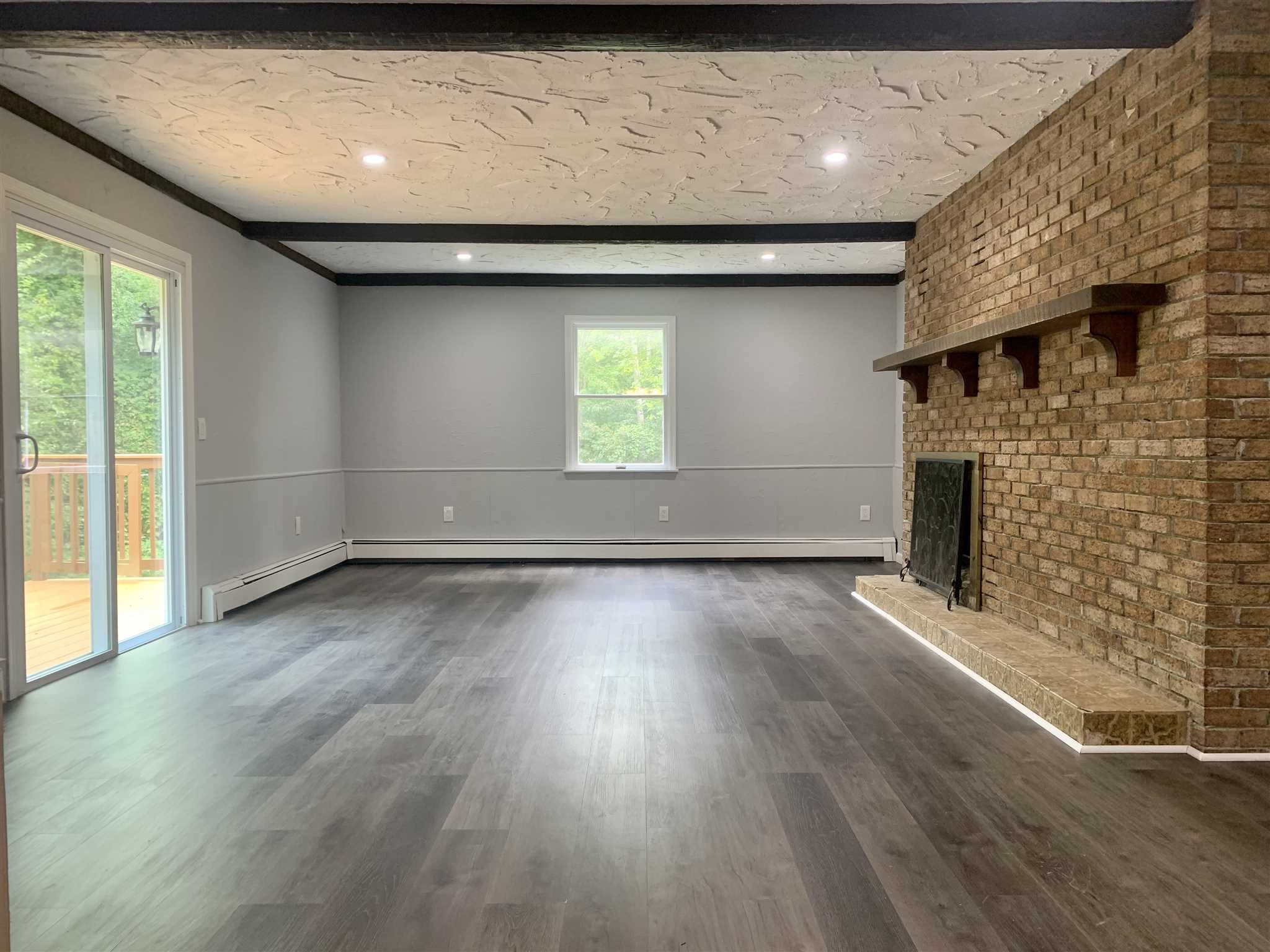 5 Alexander Road East Fishkill, NY 12533 - Photo 3 of 33 an empty room with wooden floor and windows
