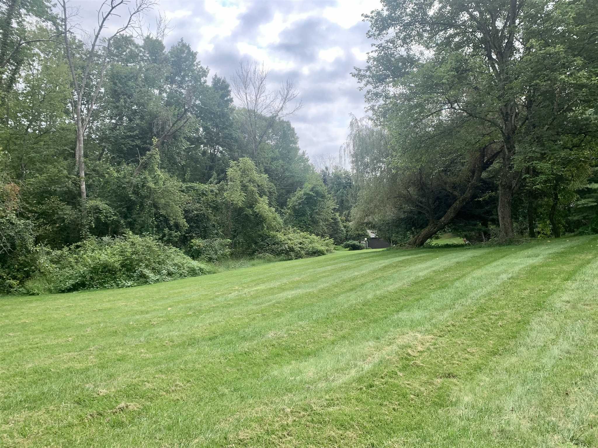 5 Alexander Road East Fishkill, NY 12533 - Photo 31 of 33 a view of a grassy field with trees in the background