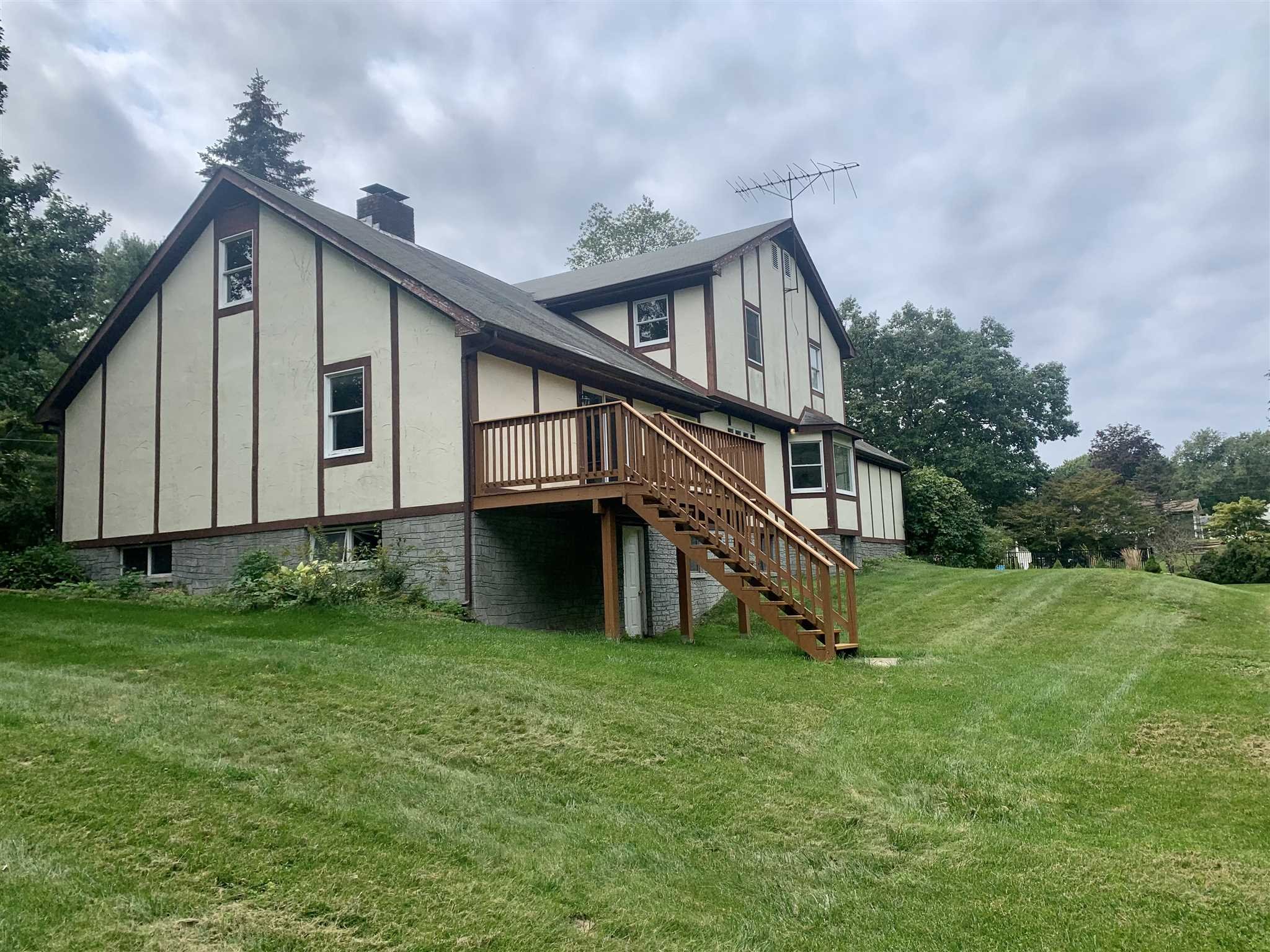 5 Alexander Road East Fishkill, NY 12533 - Photo 32 of 33 a house with green field in front of it
