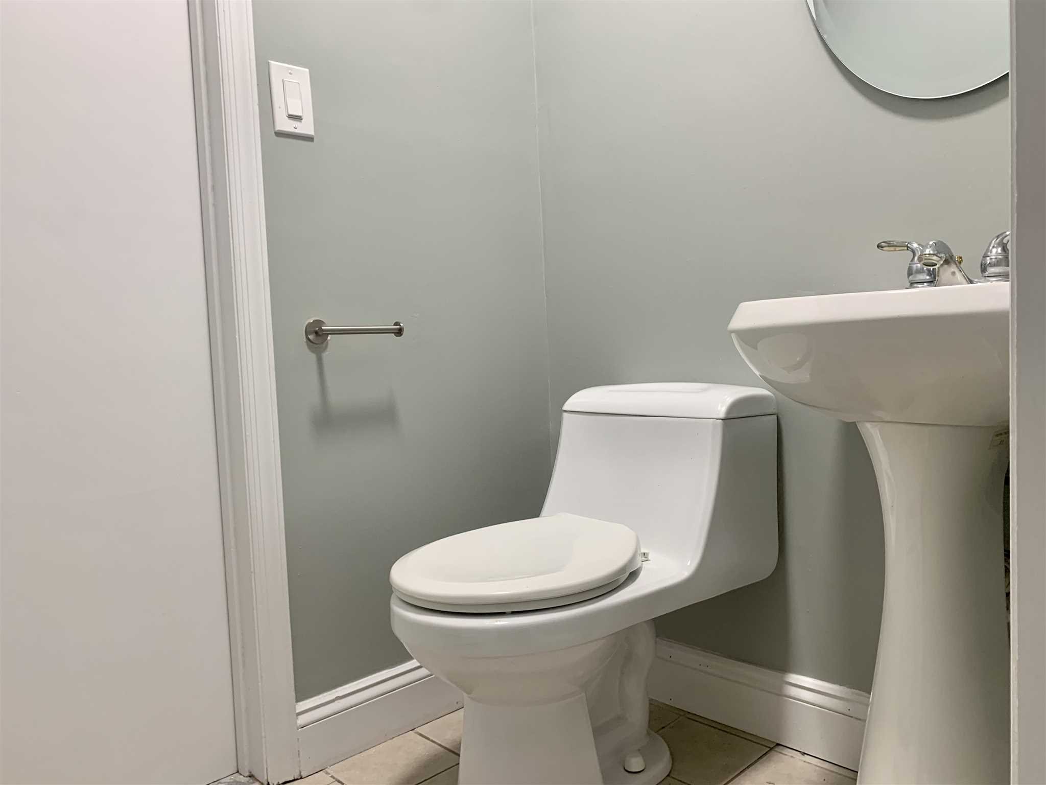 5 Alexander Road East Fishkill, NY 12533 - Photo 8 of 33 a white toilet sitting next to a bathroom sink