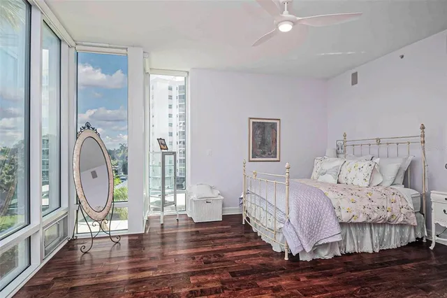 a bathroom with a granite countertop sink mirror and a bathtub