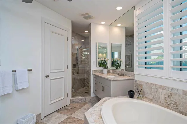 a bedroom with a bed and a wooden floor