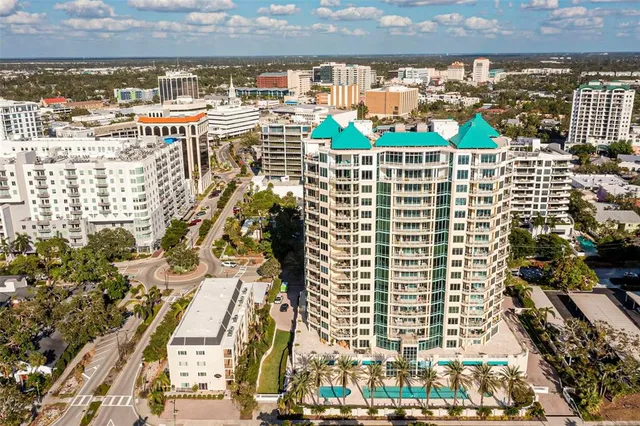 a kitchen with stainless steel appliances a sink cabinets and wooden floor