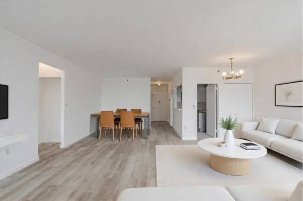 a dining room with furniture and wooden floor