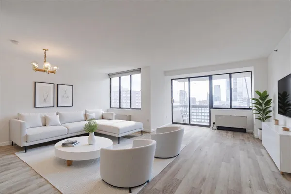 a living room with furniture and a large window