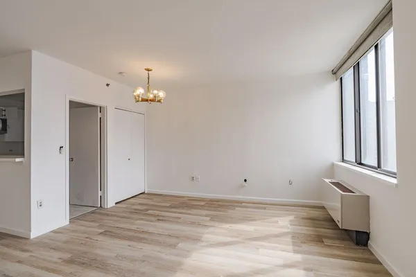 a view of room with window and hardwood floor