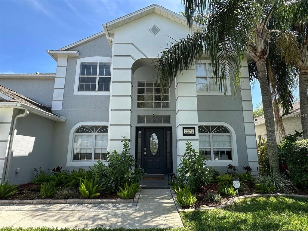 a front view of a house with garden