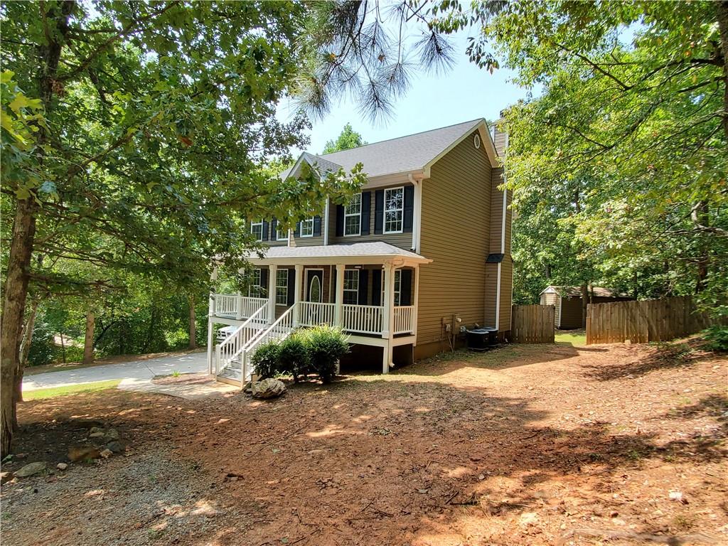 a view of a house with a yard