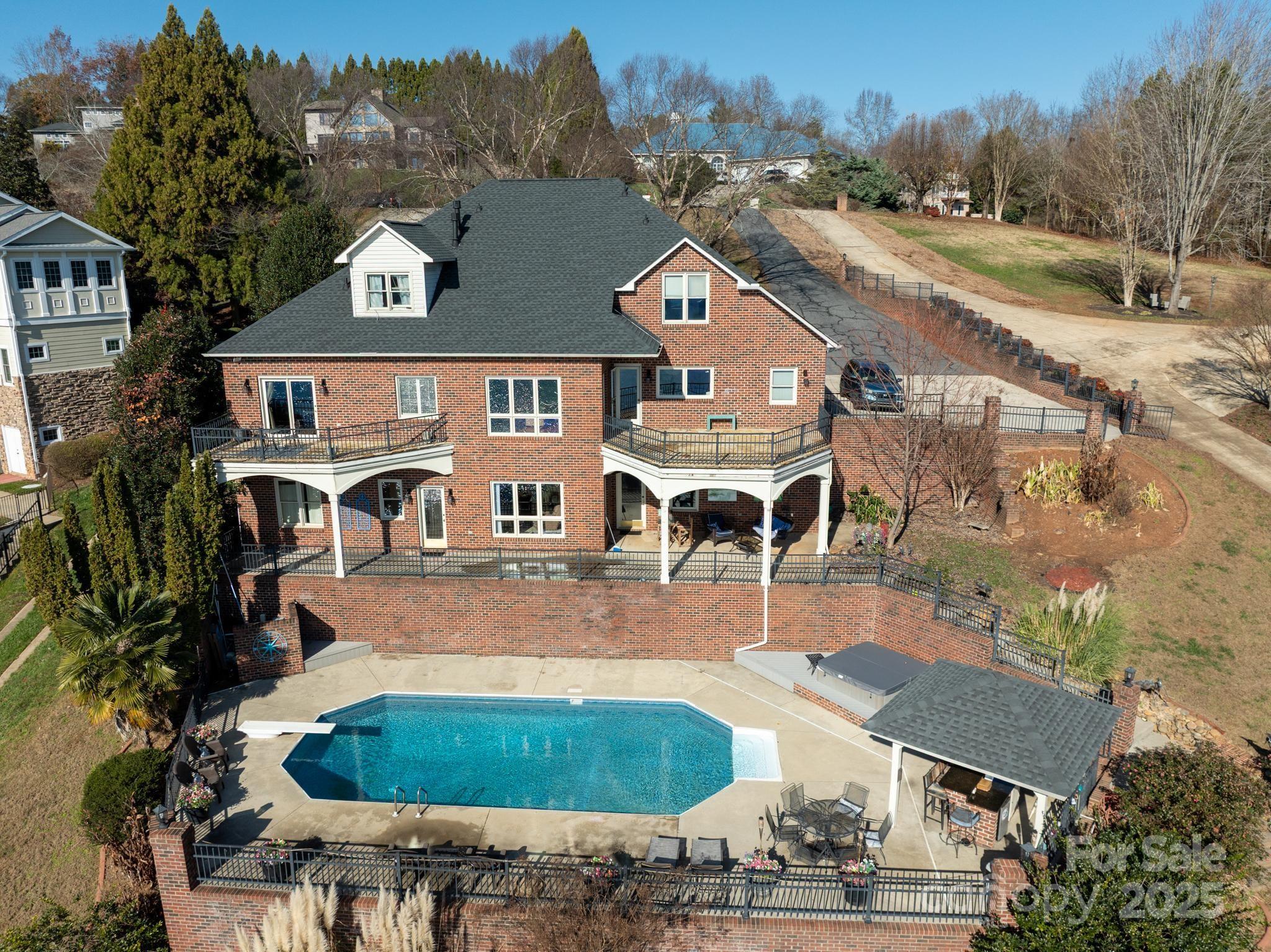 an aerial view of a house with outdoor space