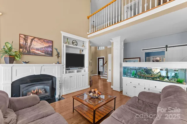 a living room with furniture a table and a potted plant