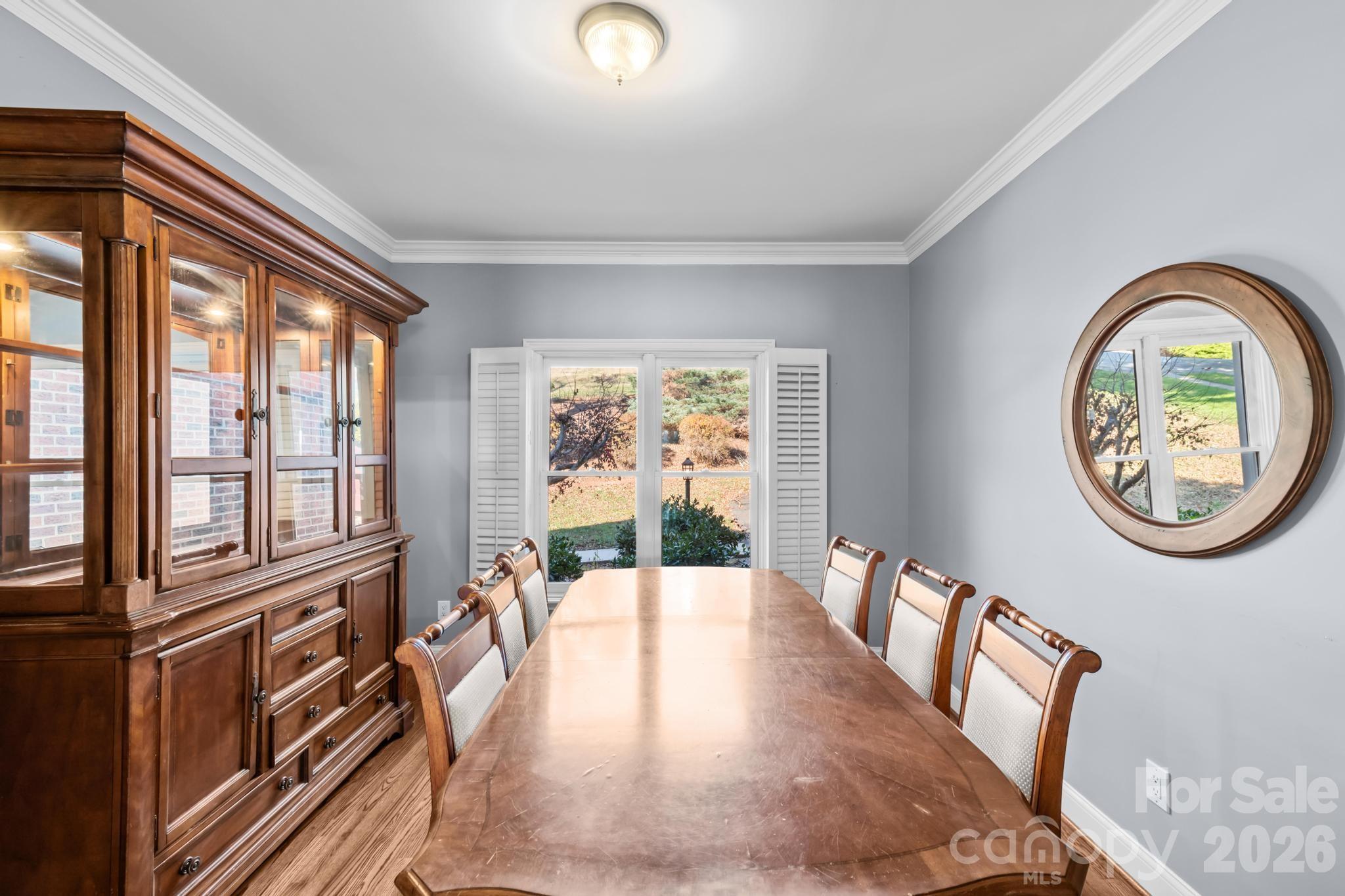 121 Pleasant Point Drive Hickory, NC 28601 - Photo 11 of 46 a view of a dining room with furniture a chandelier and wooden floor