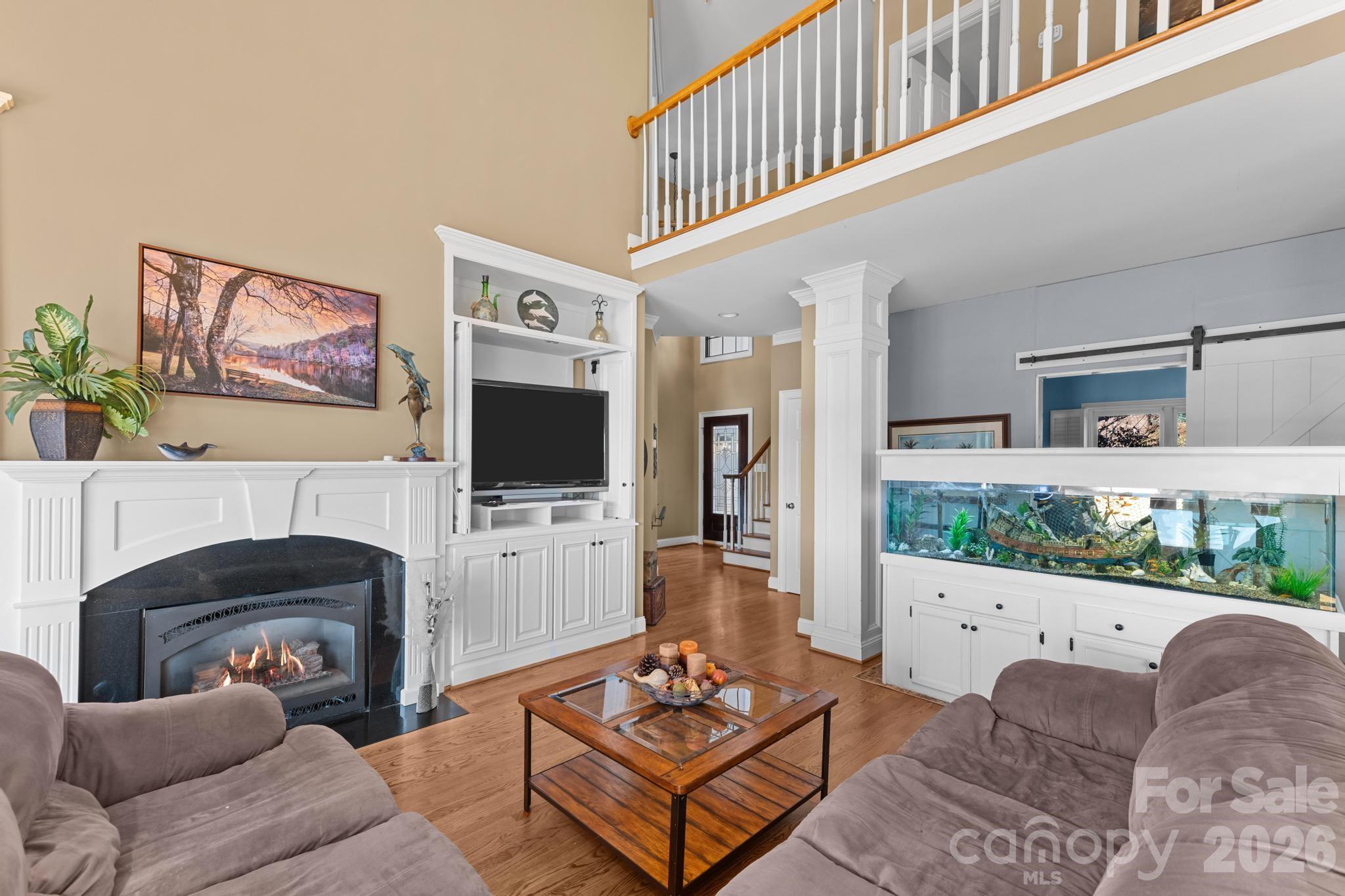 121 Pleasant Point Drive Hickory, NC 28601 - Photo 12 of 46 a living room with furniture a flat screen tv and a fireplace