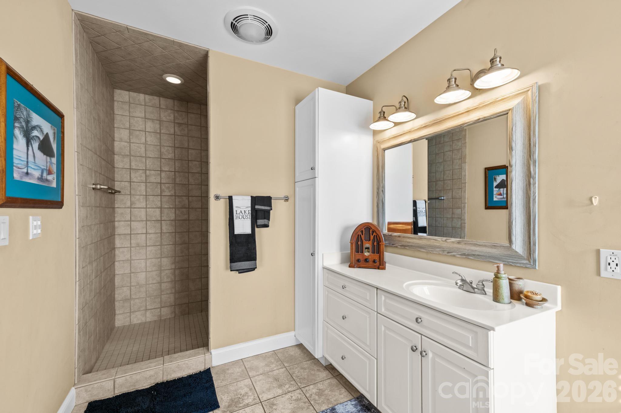 121 Pleasant Point Drive Hickory, NC 28601 - Photo 22 of 46 a bathroom with a double vanity sink mirror and shower