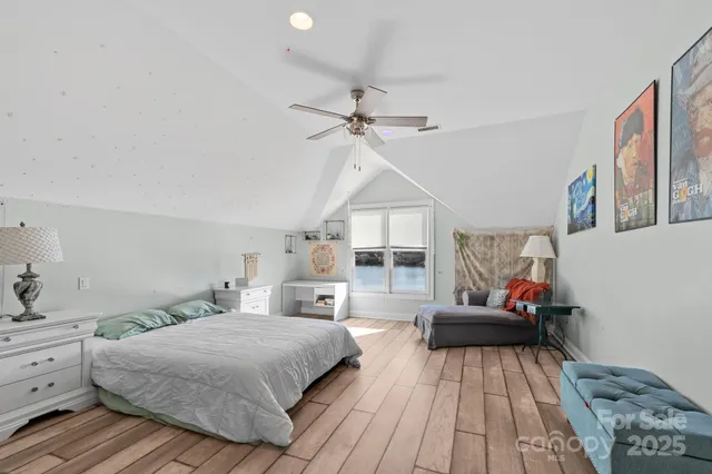 a bathroom with a sink mirror vanity and toilet