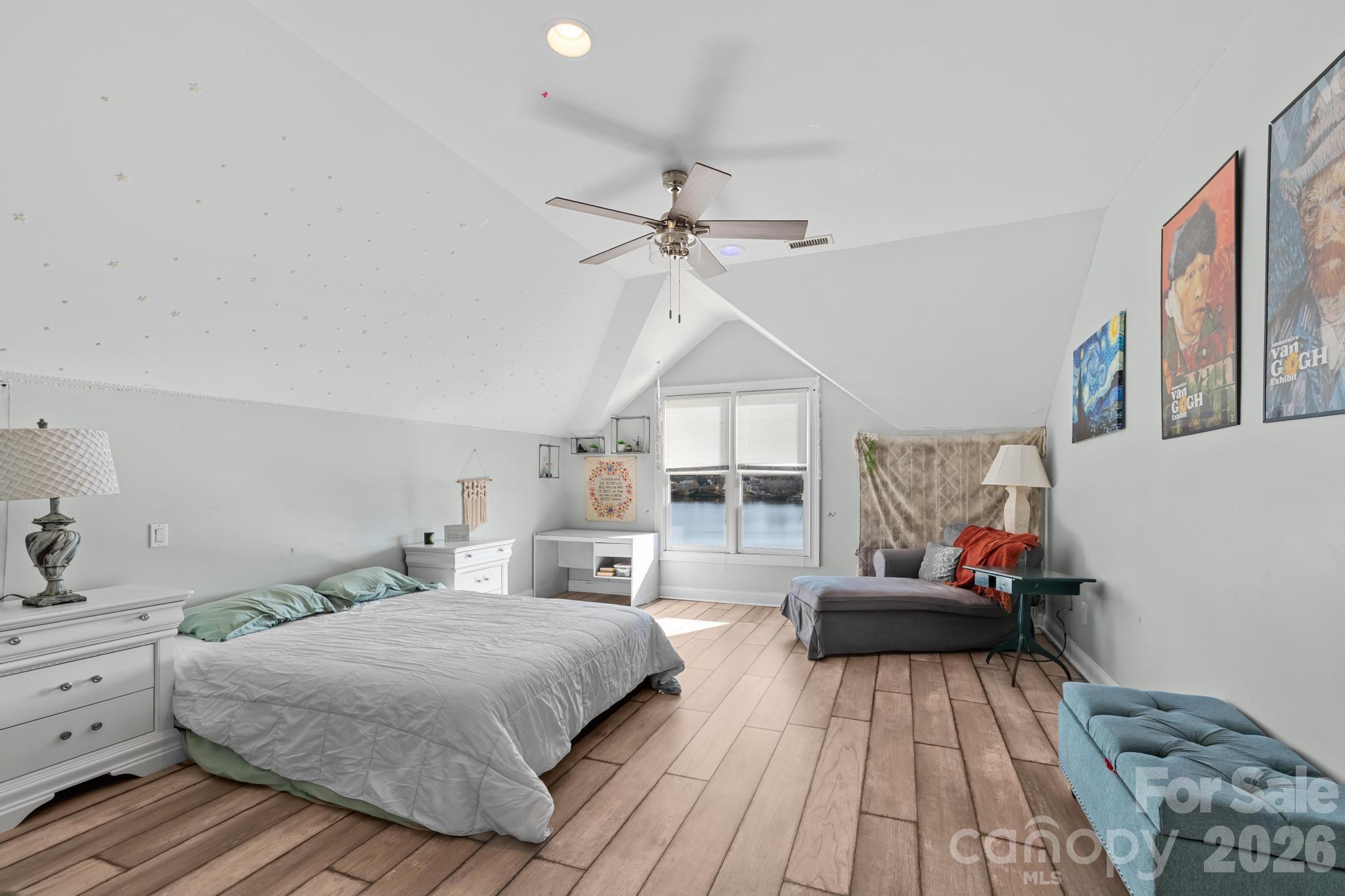 121 Pleasant Point Drive Hickory, NC 28601 - Photo 24 of 46 a bedroom with a bed and a chandelier