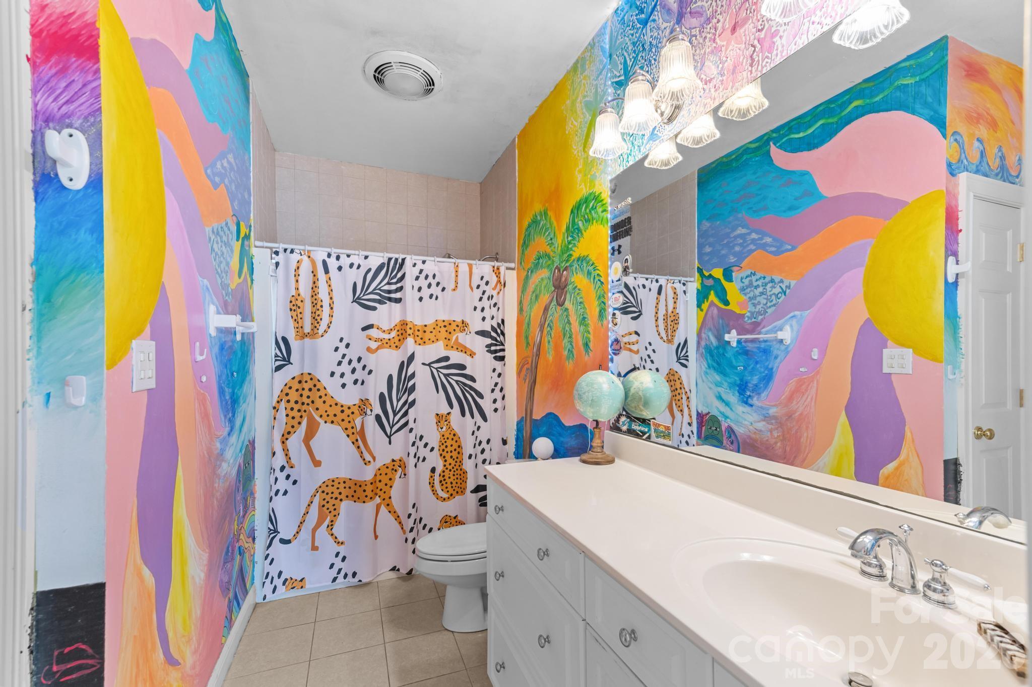 121 Pleasant Point Drive Hickory, NC 28601 - Photo 25 of 46 a bathroom with a sink mirror vanity and toilet