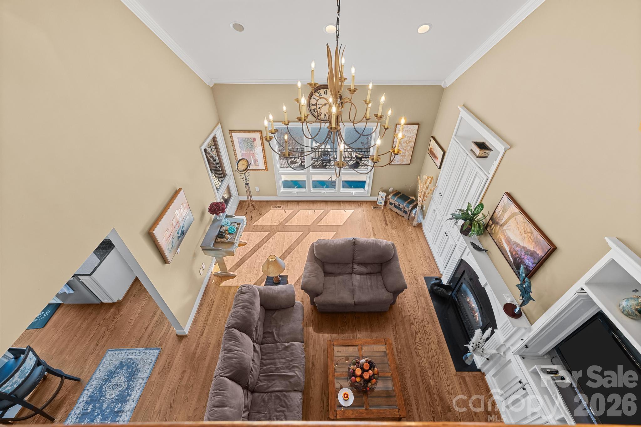 121 Pleasant Point Drive Hickory, NC 28601 - Photo 28 of 46 a living room with furniture and a chandelier