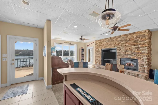 a view of a dining room with furniture and a chandelier