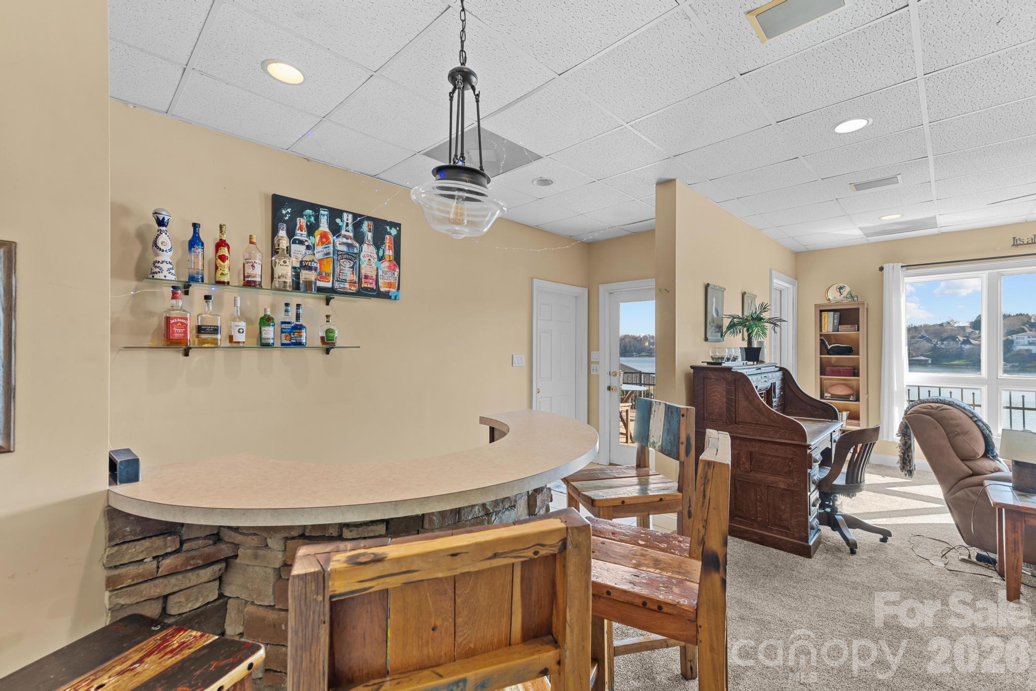 121 Pleasant Point Drive Hickory, NC 28601 - Photo 32 of 46 a view of a dining room with furniture and a chandelier