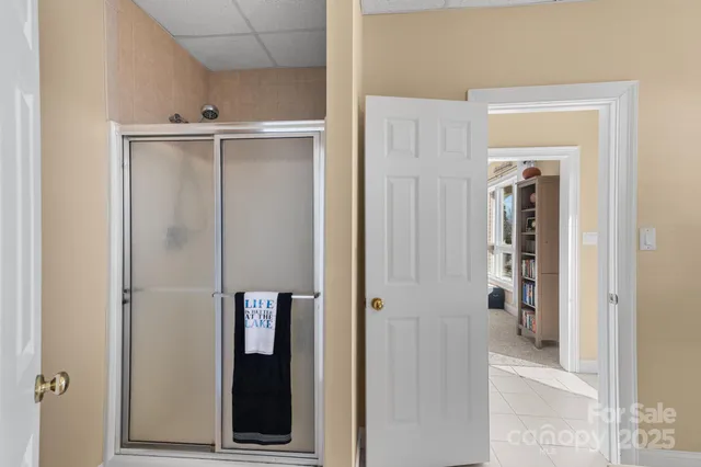 a kitchen with granite countertop a sink stainless steel appliances wooden floor and cabinets