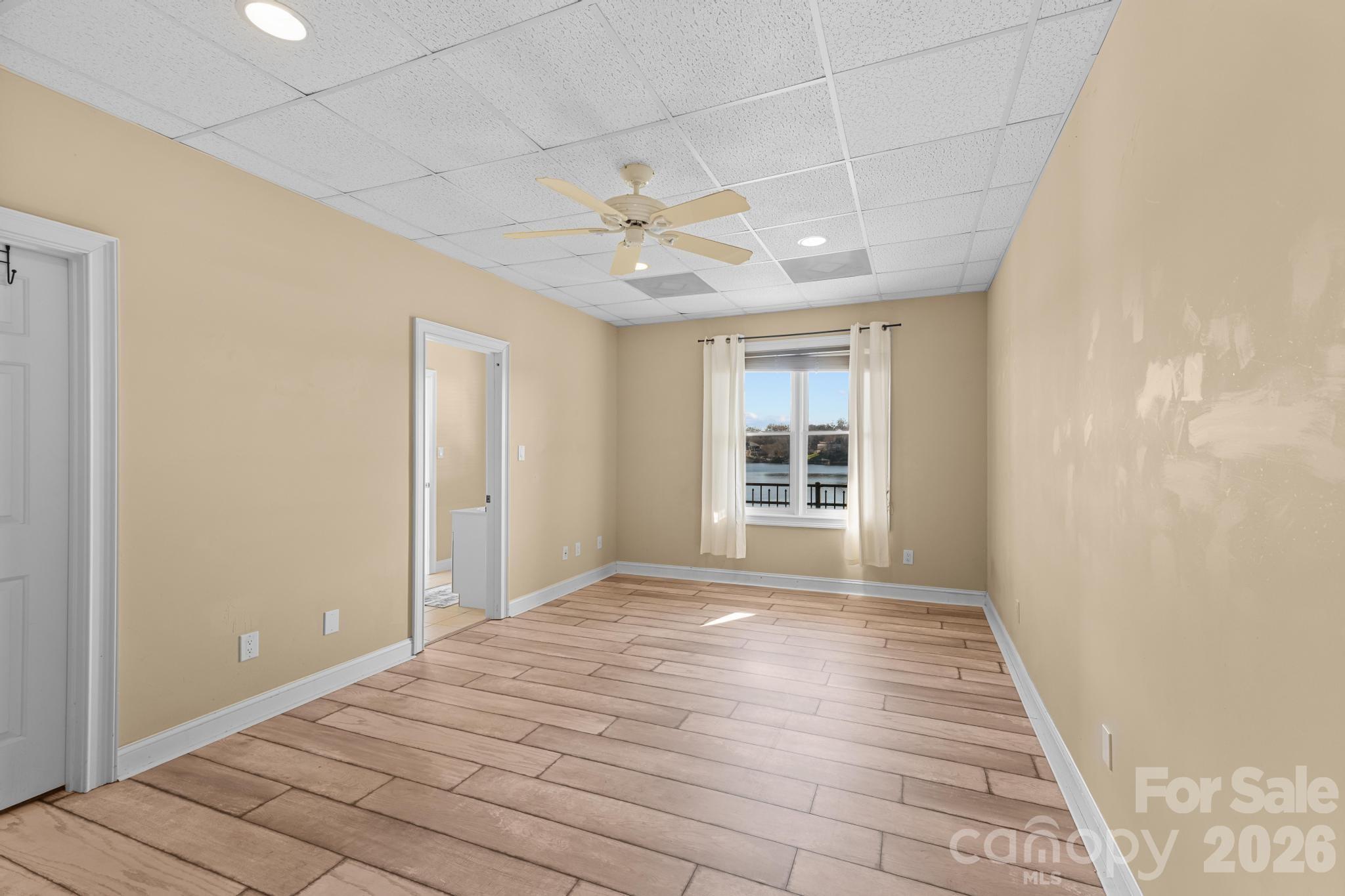 121 Pleasant Point Drive Hickory, NC 28601 - Photo 33 of 46 a view of empty room with wooden floor and fan