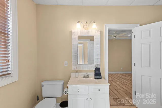 a view of a patio with table and chairs potted plants with wooden floor