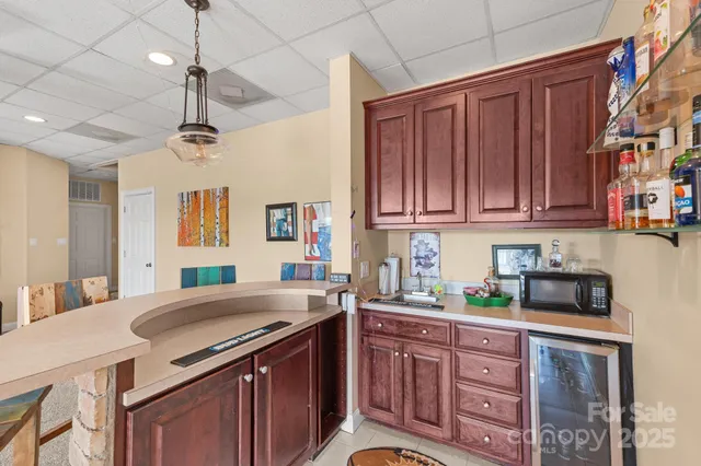 a view of a kitchen with a sink and dishwasher