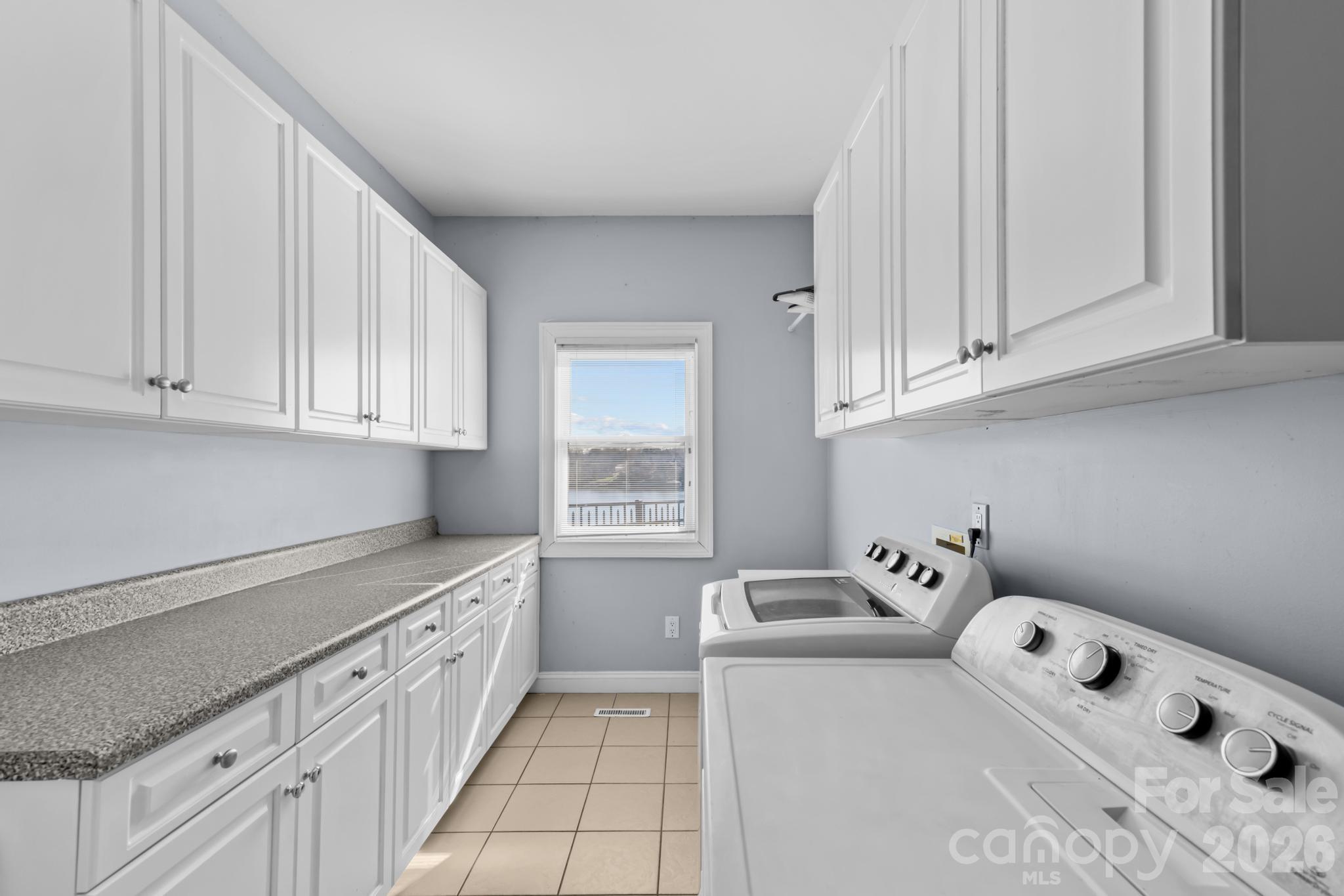 121 Pleasant Point Drive Hickory, NC 28601 - Photo 10 of 46 a kitchen with cabinets and window