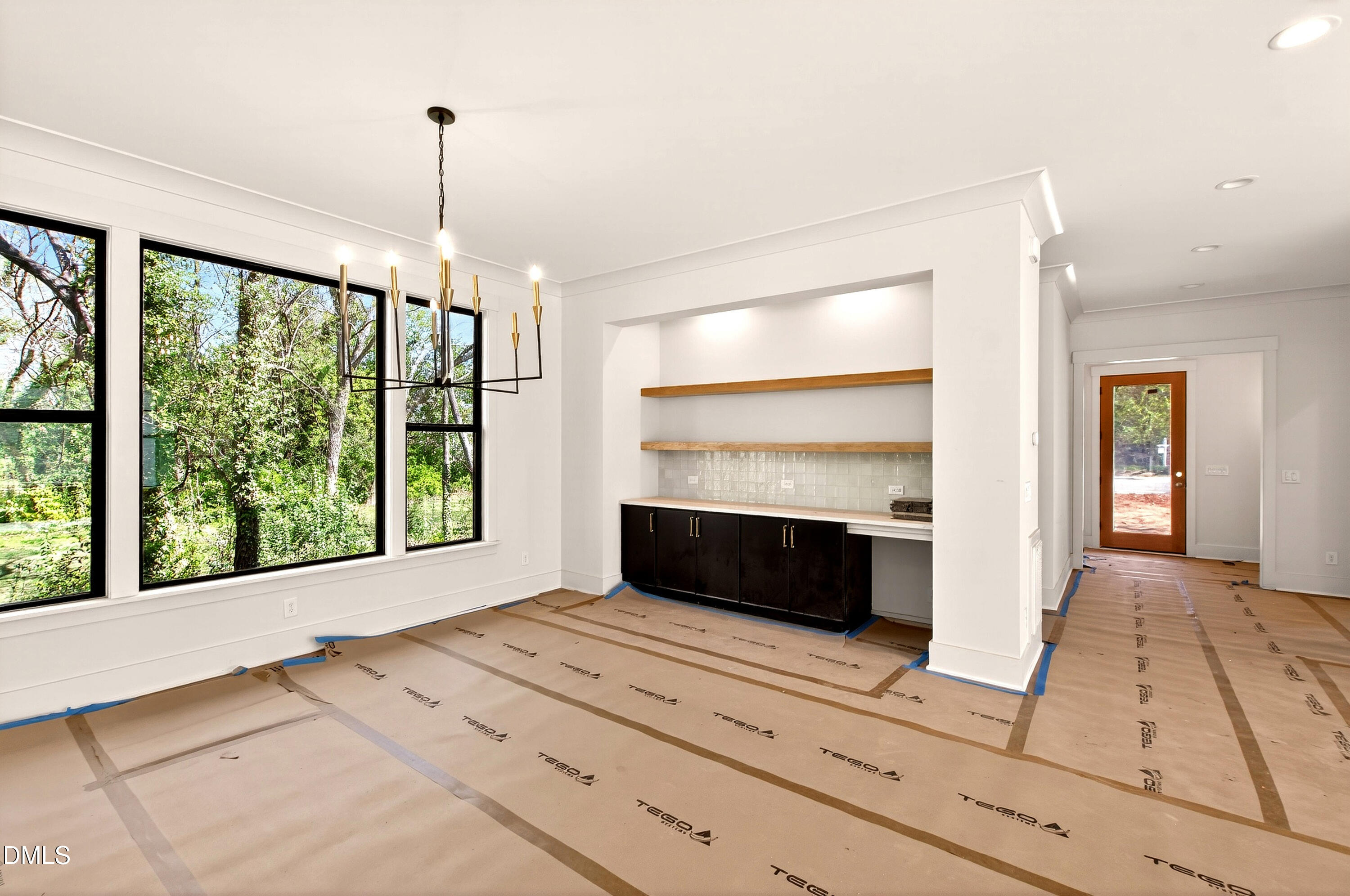 909 Oberlin Road Raleigh, NC 27605 - Photo 11 of 59 a bedroom with a bed and a large window